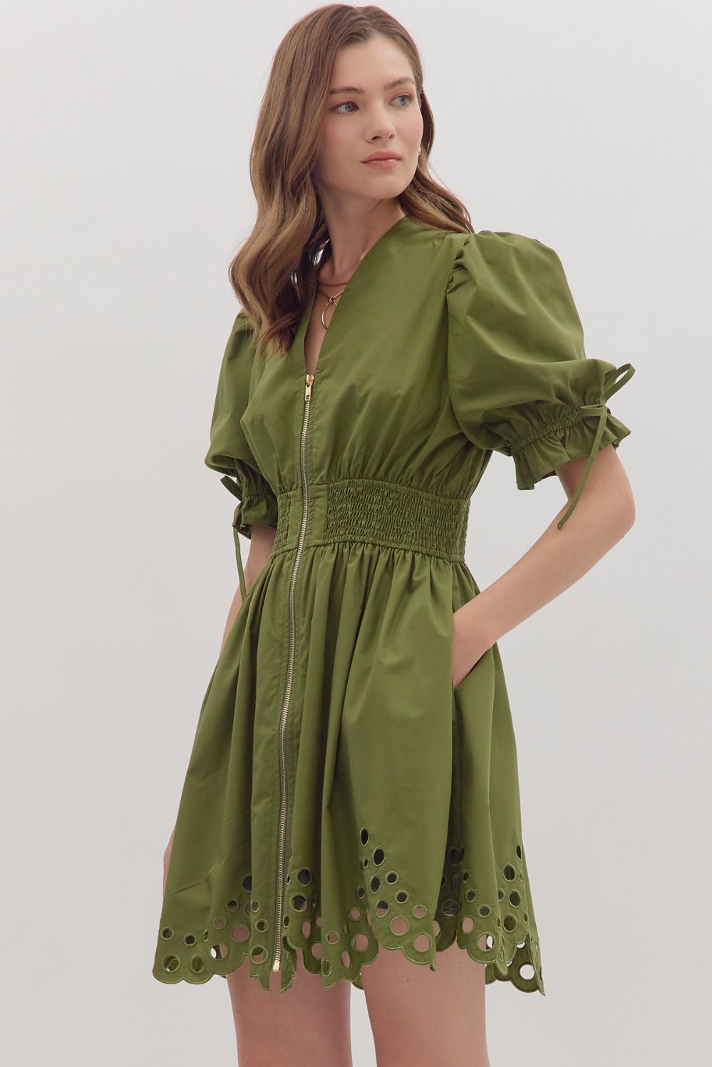 Flirty and flattering, the Ivy mini dress pairs romantic puff sleeves with a smocked waist, V-neck, and scalloped eyelet hem for instant outfit magic.