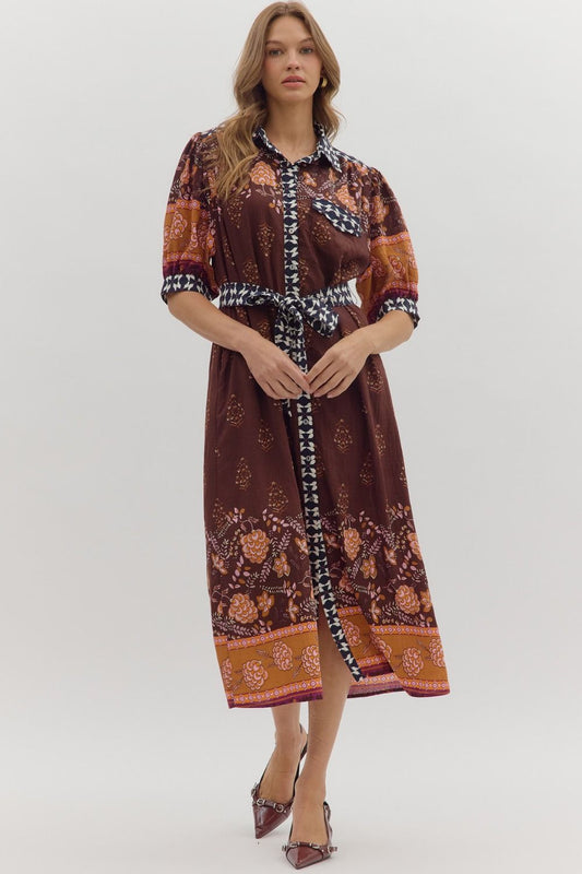 Playful yet refined, the Maribel midi dress pairs puff sleeves with contrast accents for a chic everyday statement.