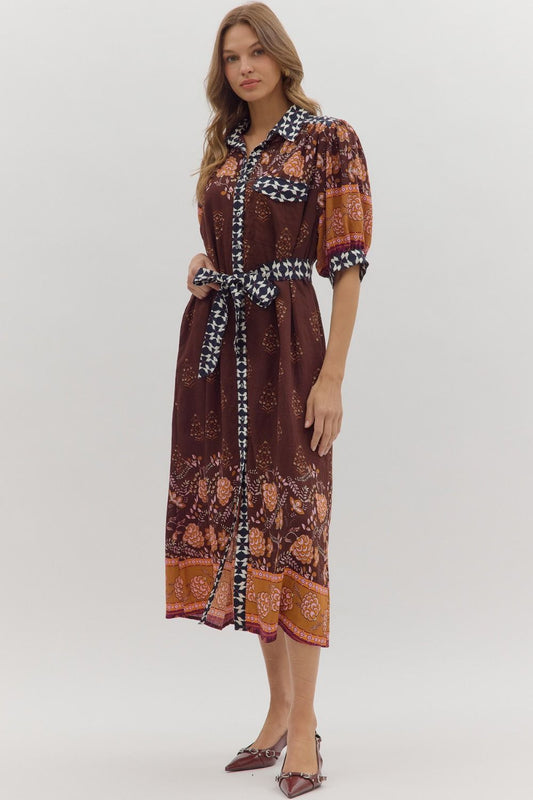 Playful yet refined, the Maribel midi dress pairs puff sleeves with contrast accents for a chic everyday statement.