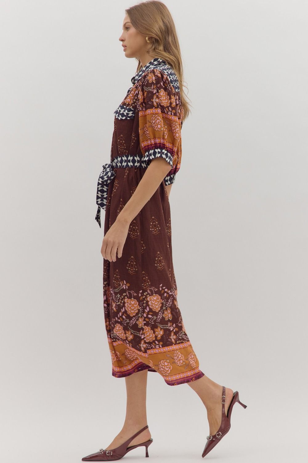 Playful yet refined, the Maribel midi dress pairs puff sleeves with contrast accents for a chic everyday statement.