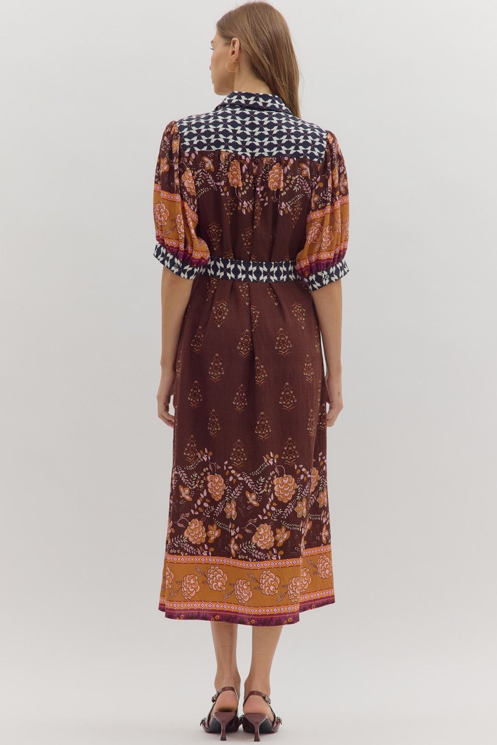 Playful yet refined, the Maribel midi dress pairs puff sleeves with contrast accents for a chic everyday statement.