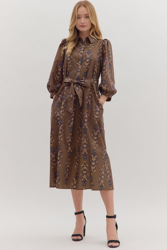 Effortlessly feminine, the Cecily midi dress pairs a botanical print with puff sleeves, a detachable waist tie, and timeless everyday ease.