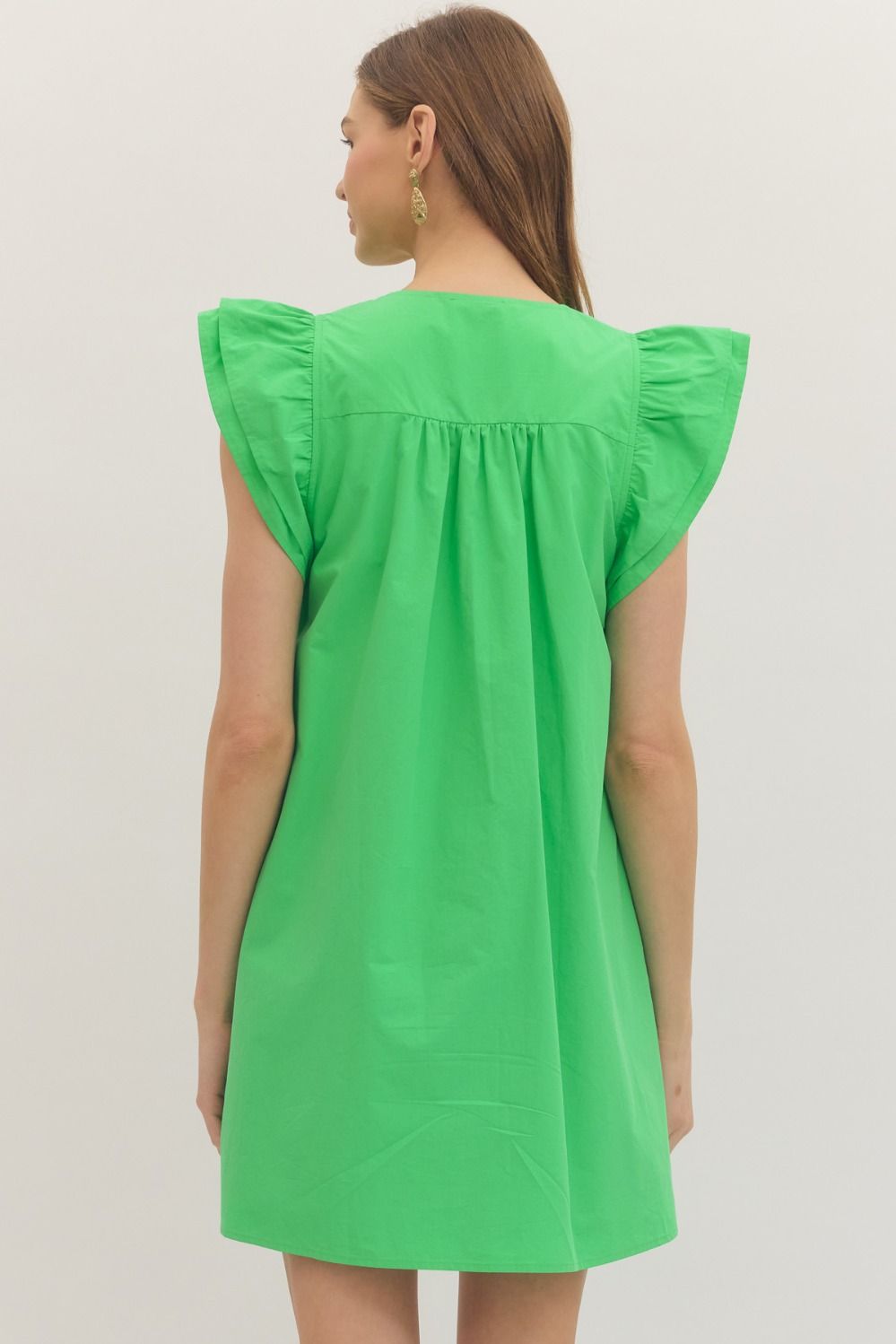 cotton mini dress with flutter sleeves, pintuck pleating, and a relaxed, feminine silhouette