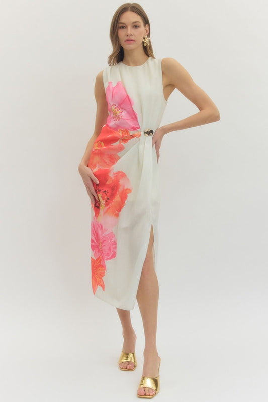Floral sleeveless midi dress with draped front panel and decorative ring detail.