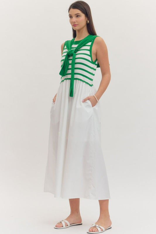 Striped sleeveless midi dress with contrast sweater overlay

