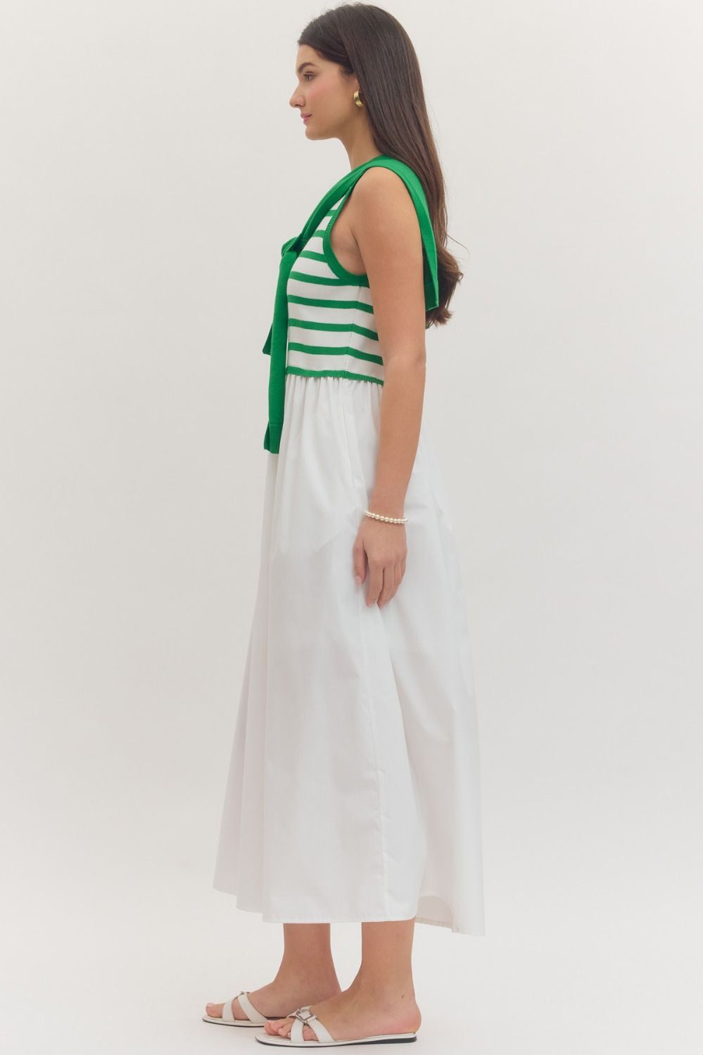 Striped sleeveless midi dress with contrast sweater overlay
