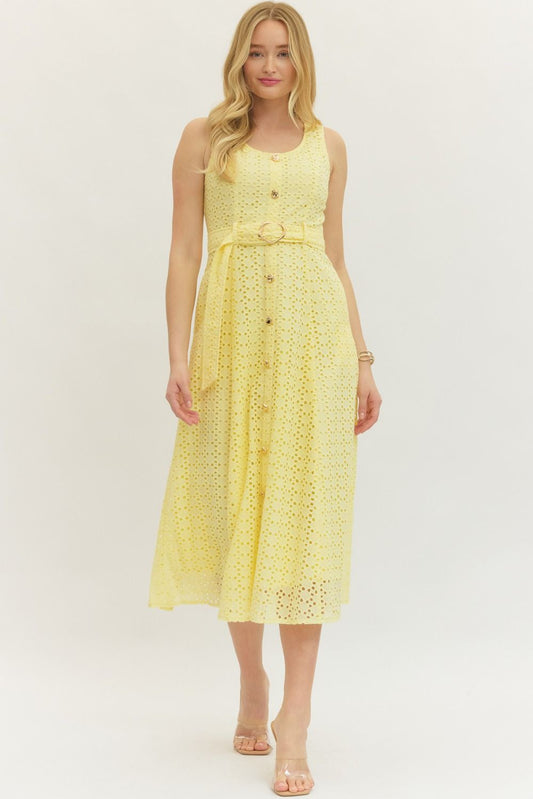 cotton eyelet midi dress with a belted waist, smocked back, and elegant, structured silhouette.
