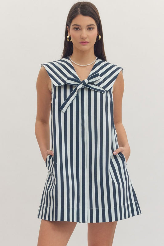 navy and white striped dress with a bow neckline 