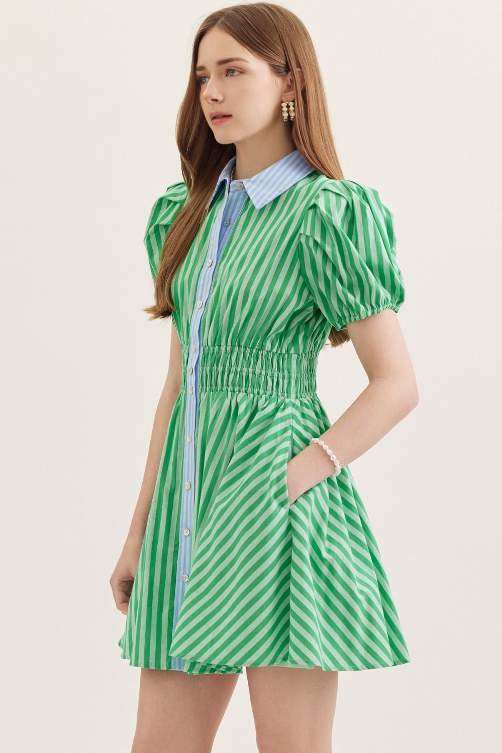  lightweight cotton mini dress with short puff sleeves, a smocked waist, and a classic stripe print