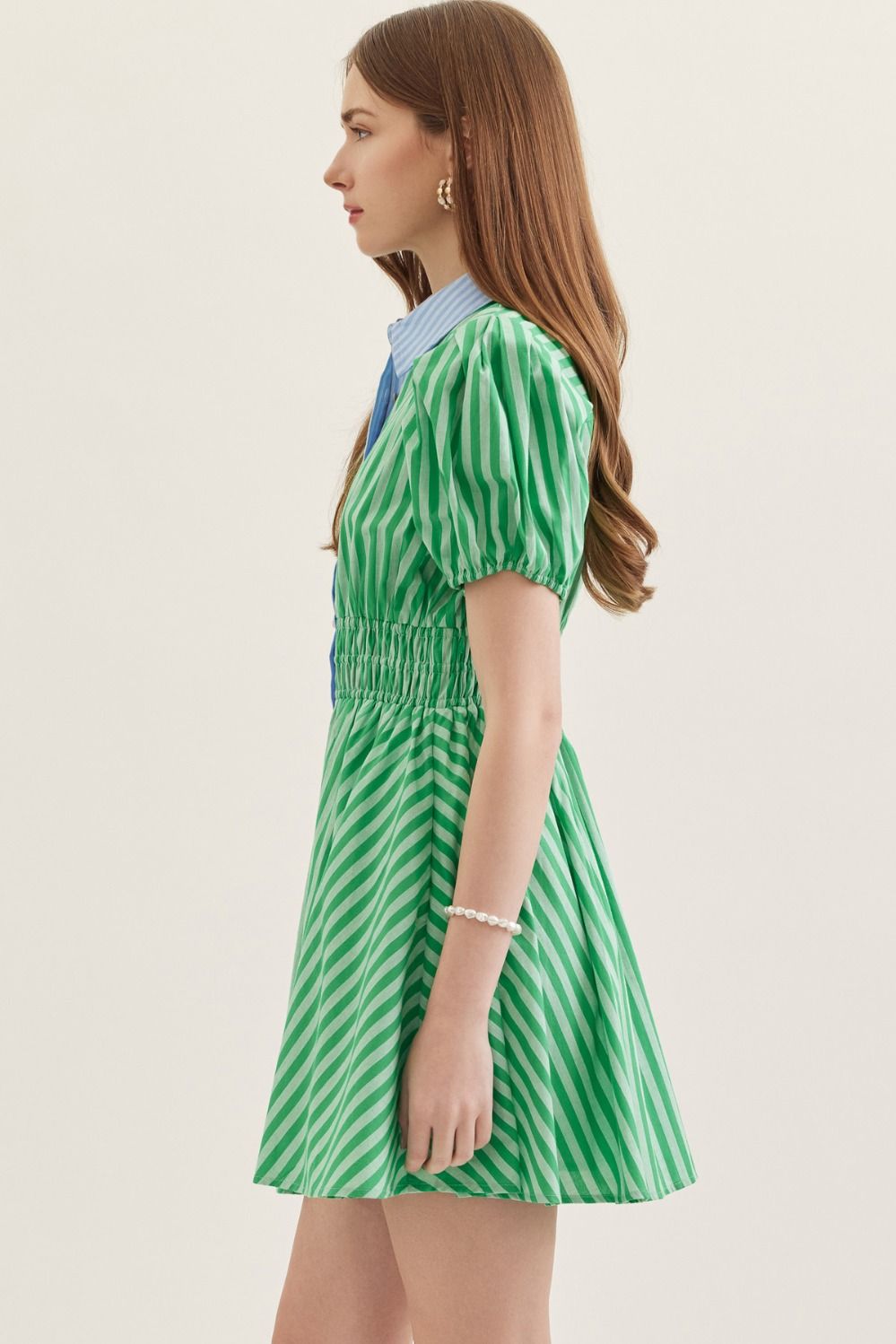  lightweight cotton mini dress with short puff sleeves, a smocked waist, and a classic stripe print