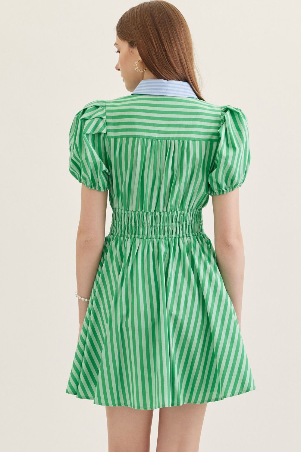  lightweight cotton mini dress with short puff sleeves, a smocked waist, and a classic stripe print