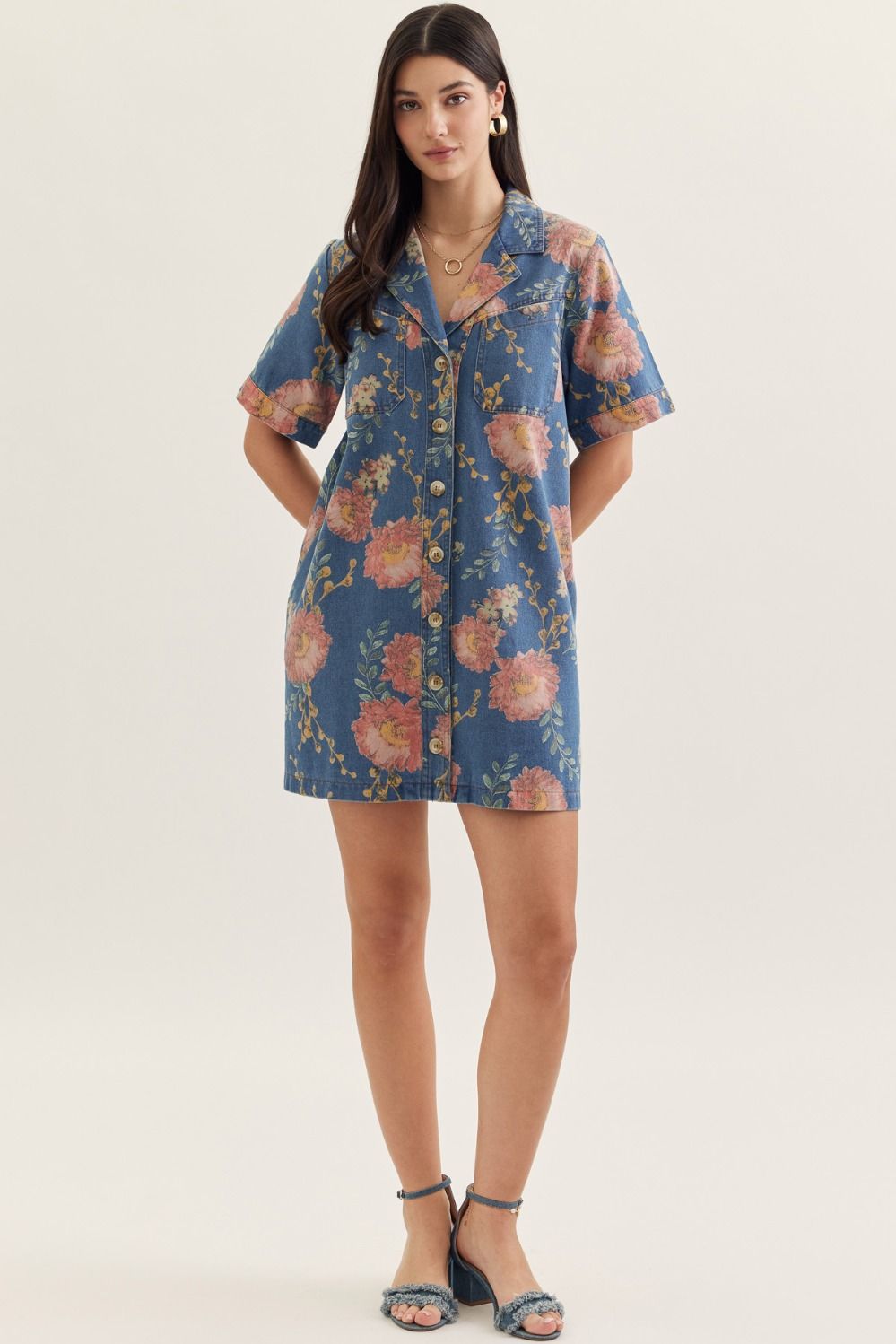denim mini dress with short sleeves, a notched collar, and botanical print detailing