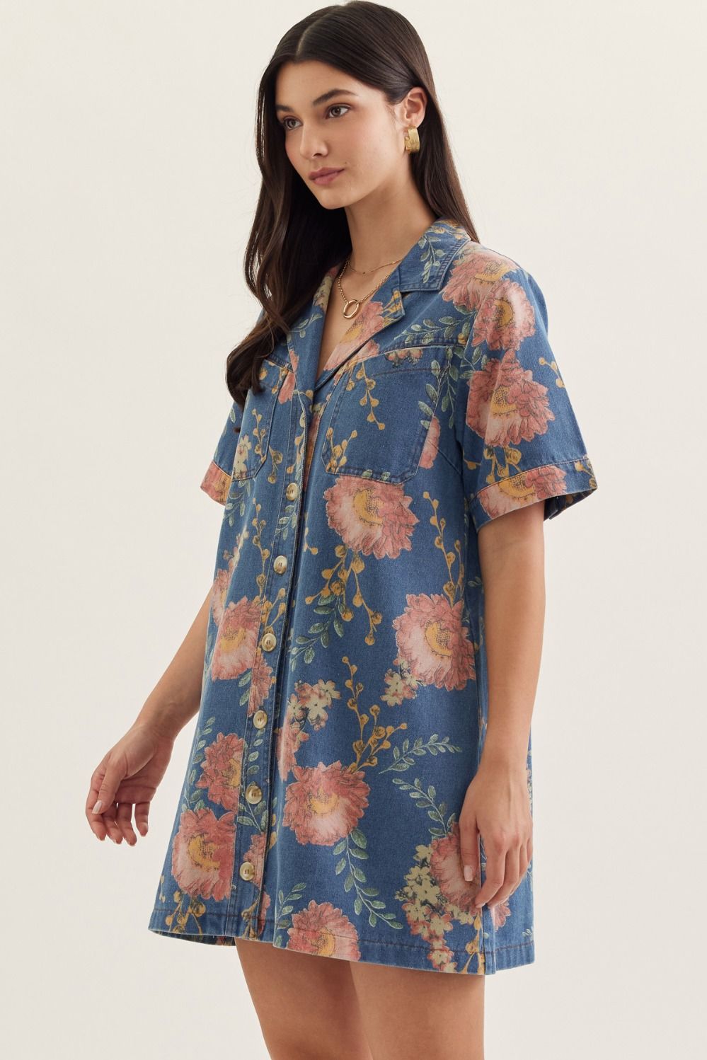 denim mini dress with short sleeves, a notched collar, and botanical print detailing