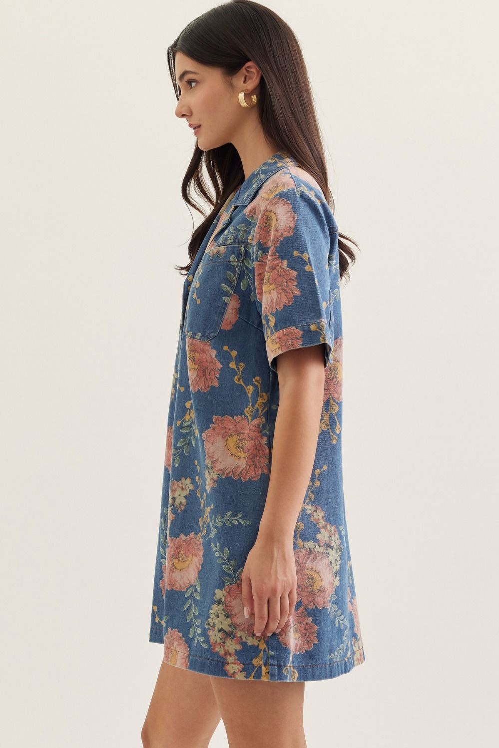 denim mini dress with short sleeves, a notched collar, and botanical print detailing