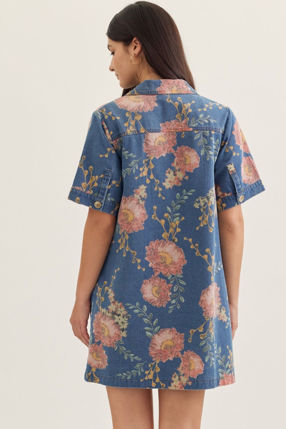 denim mini dress with short sleeves, a notched collar, and botanical print detailing