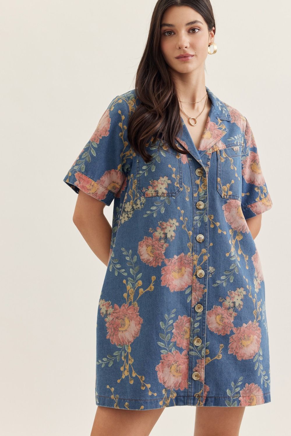 denim mini dress with short sleeves, a notched collar, and botanical print detailing