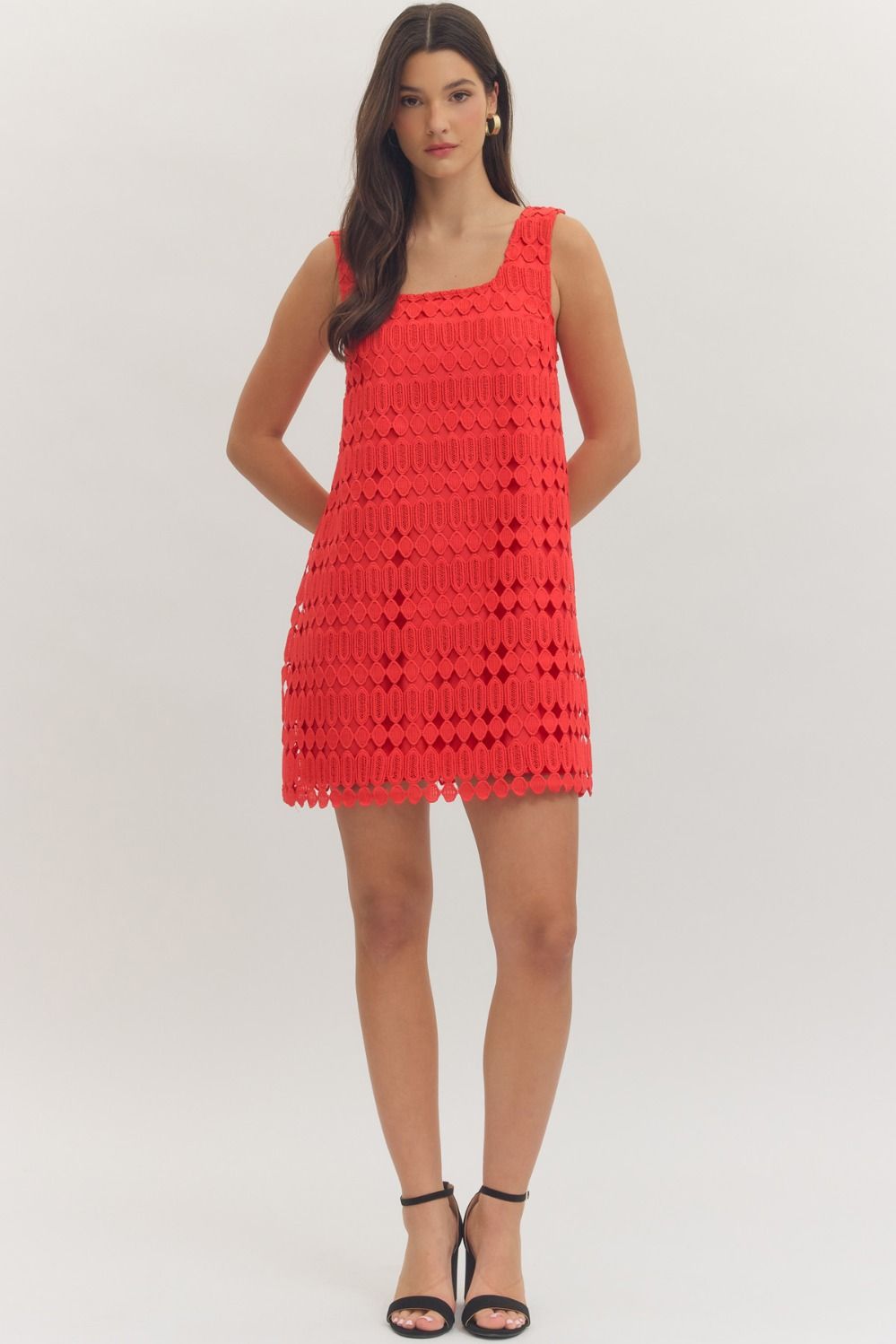 sleeveless mini dress featuring a textured openwork overlay and a modern square neckline
