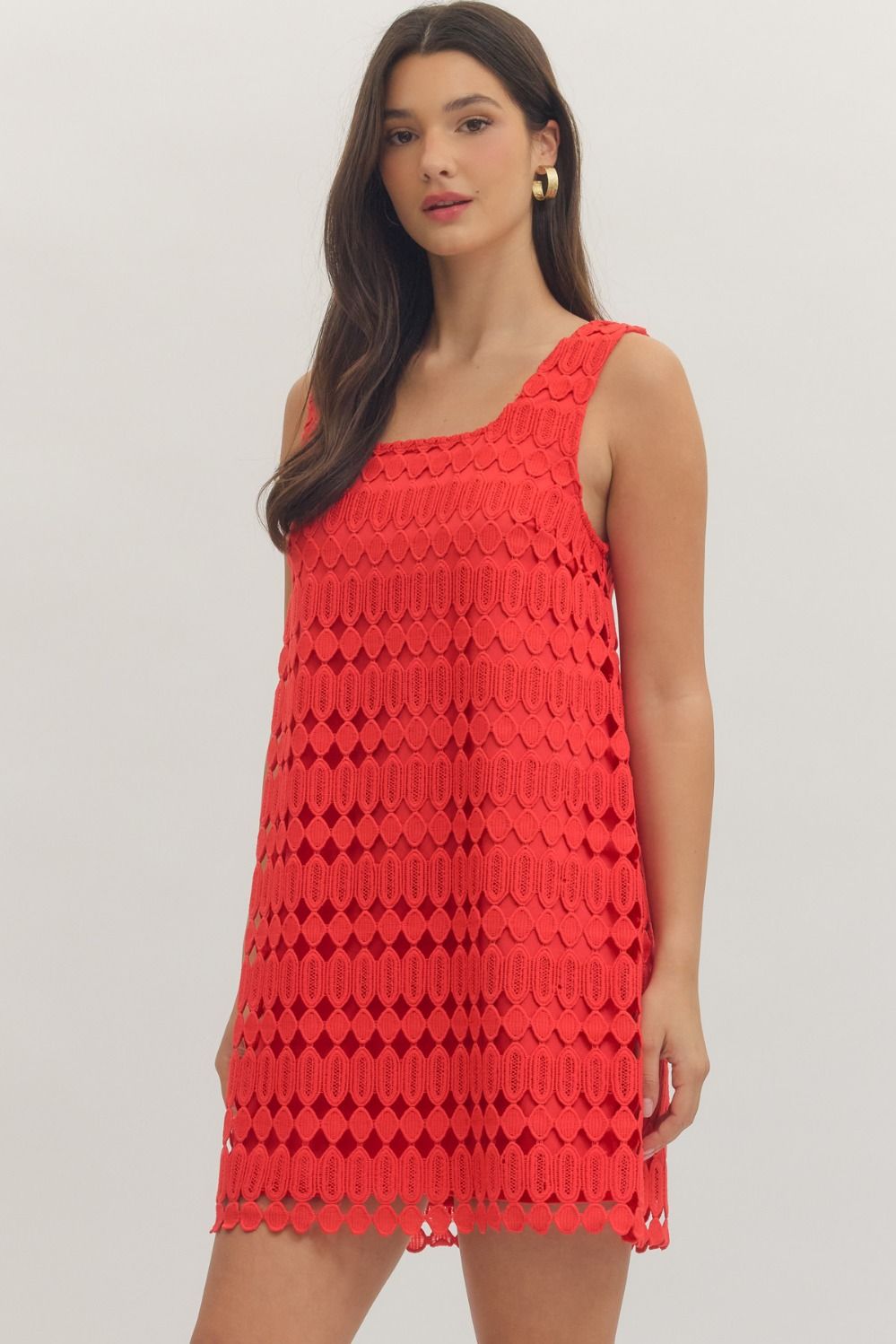 sleeveless mini dress featuring a textured openwork overlay and a modern square neckline