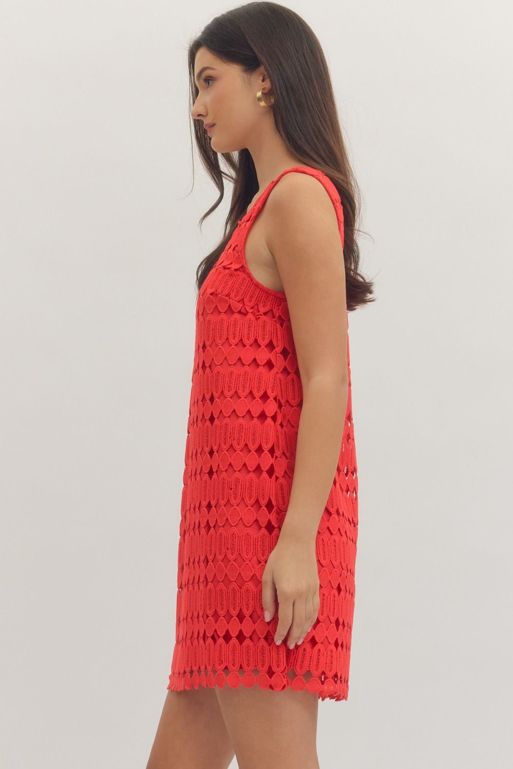 sleeveless mini dress featuring a textured openwork overlay and a modern square neckline