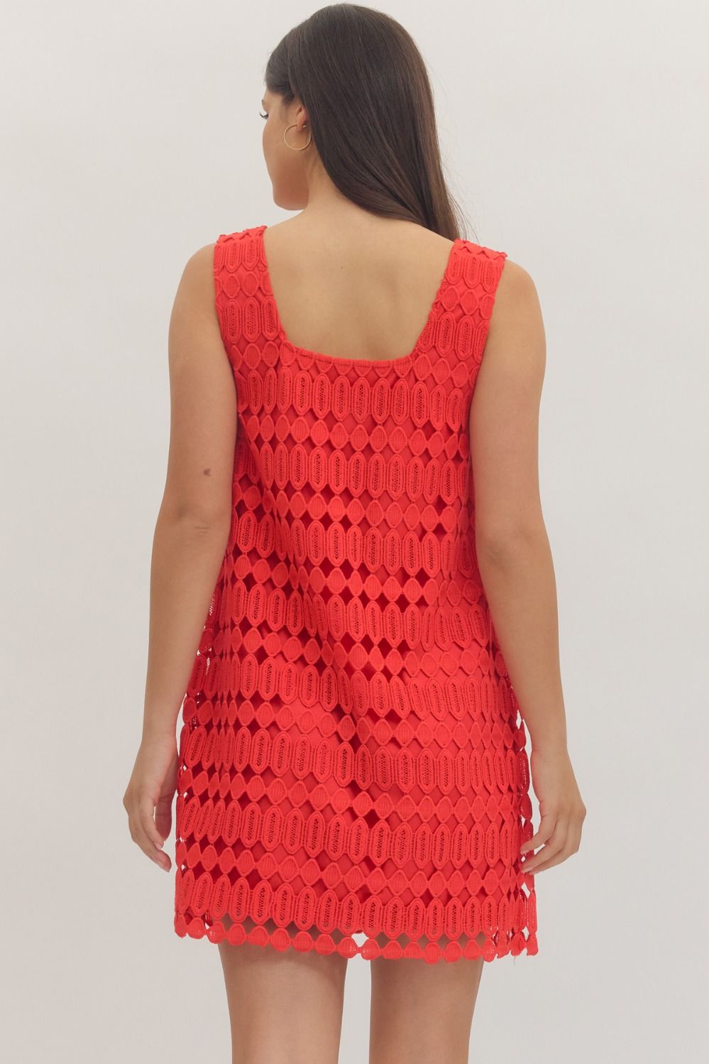 sleeveless mini dress featuring a textured openwork overlay and a modern square neckline