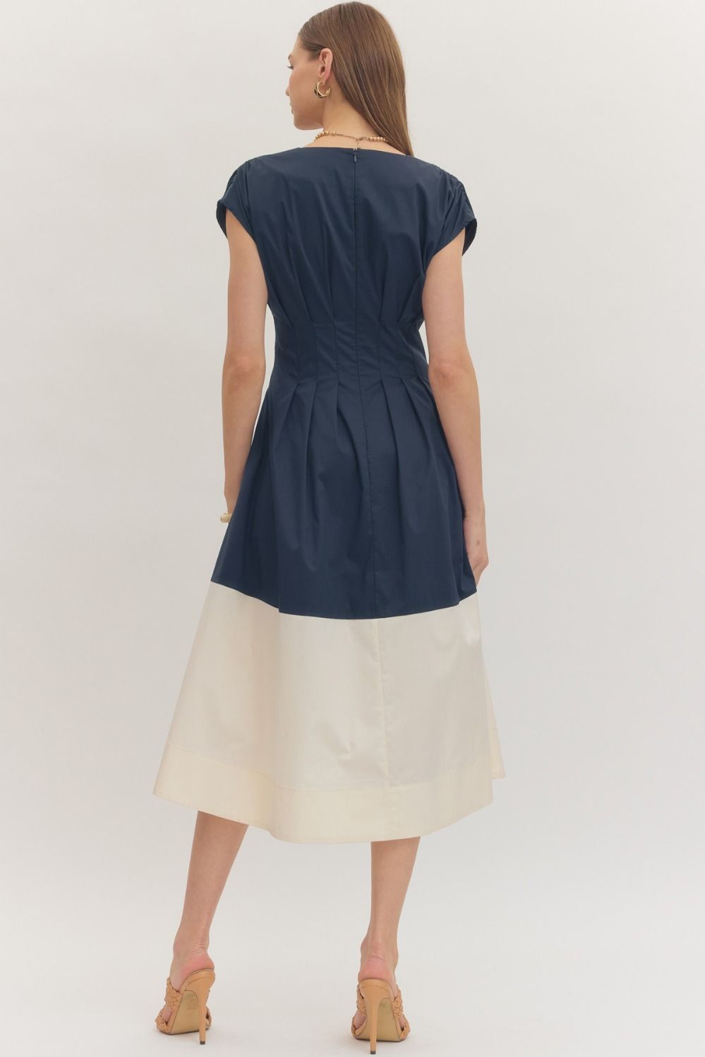  Colorblock Hem Midi Dress features a flattering pleated waist, cap sleeves, and a bold contrast hem 