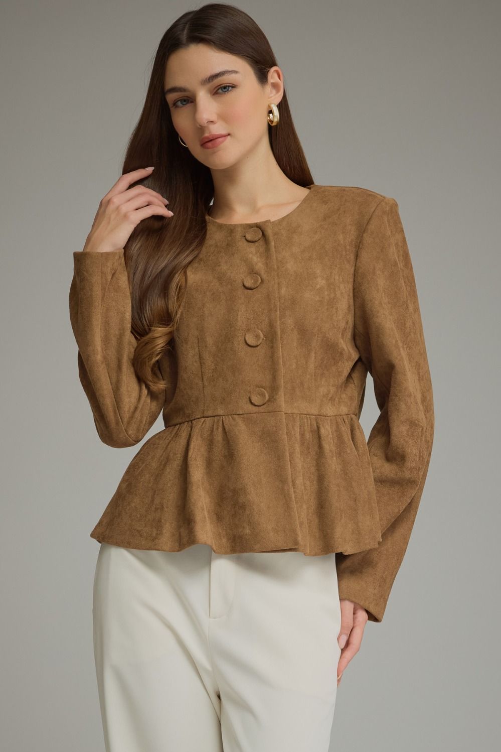 Solid woven women's jacket with round neckline, long sleeves, fabric-covered buttons, and gathered peplum hem