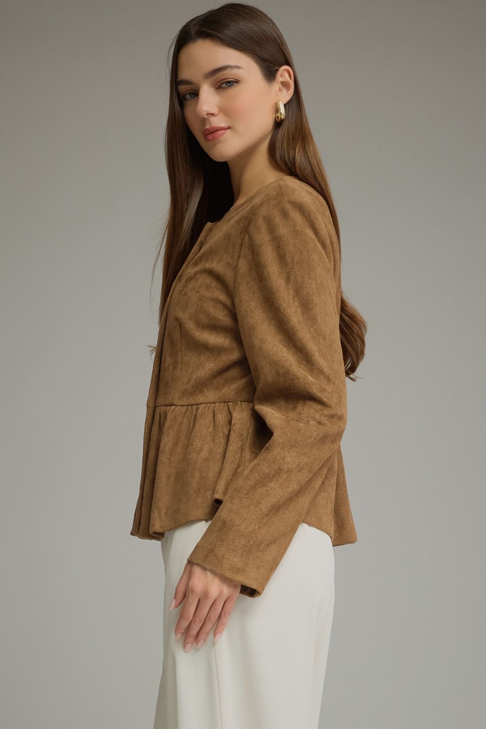 Solid woven women's jacket with round neckline, long sleeves, fabric-covered buttons, and gathered peplum hem