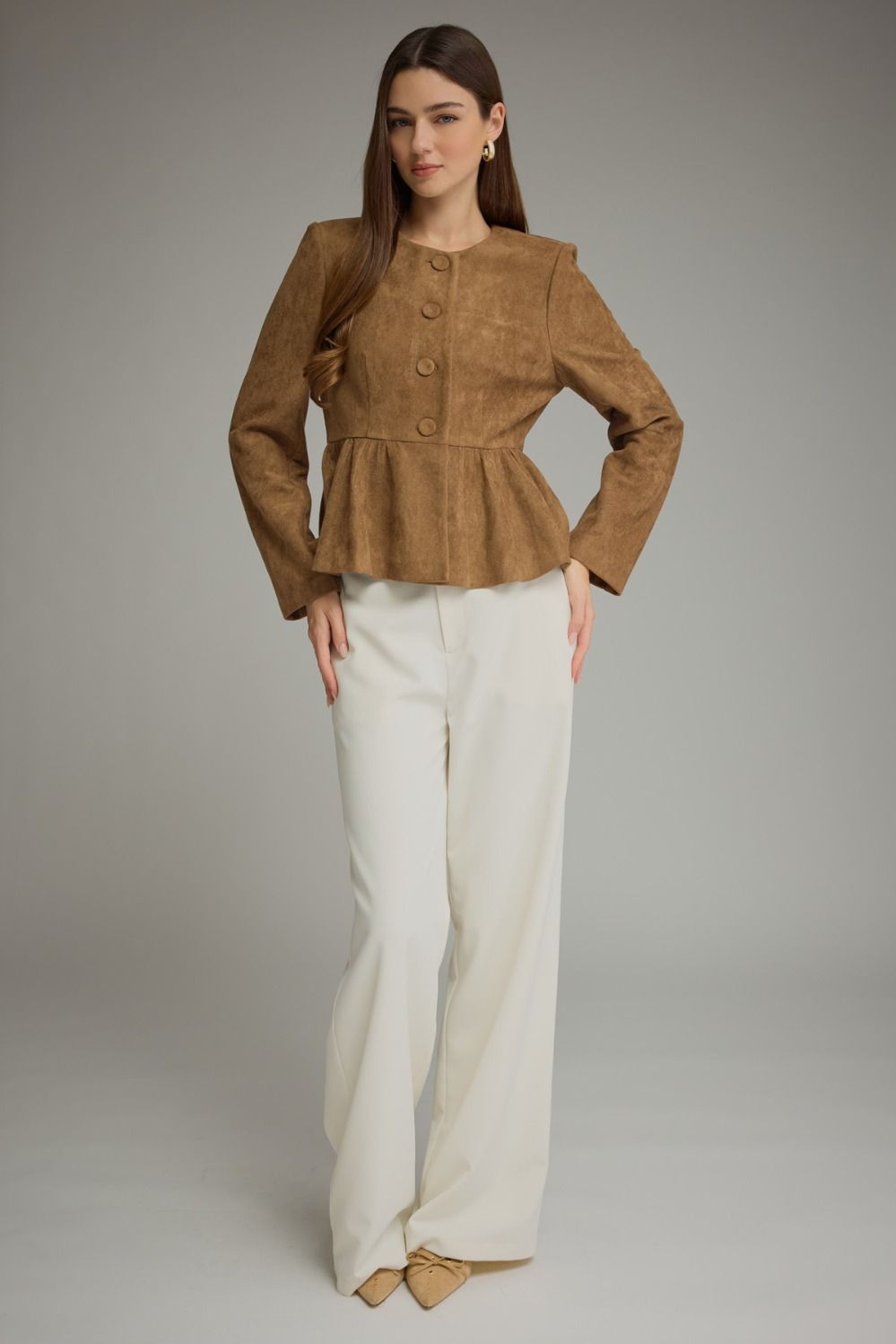 Solid woven women's jacket with round neckline, long sleeves, fabric-covered buttons, and gathered peplum hem