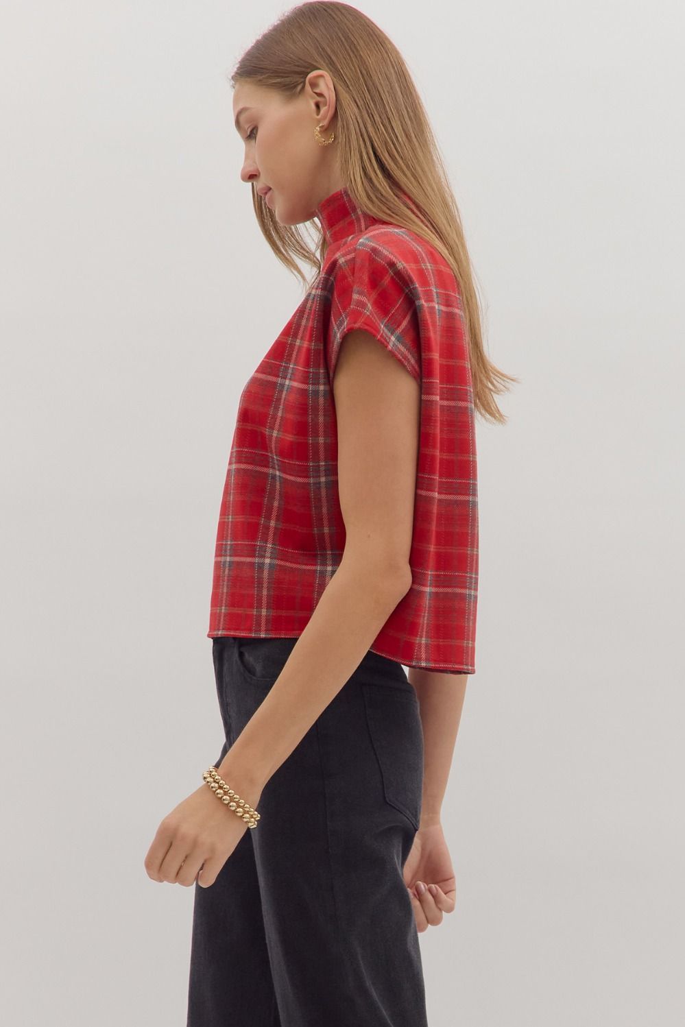 Classic plaid meets modern edge in the Maribel top, designed with a chic mock neck and sleek short sleeves.