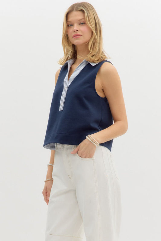  sleeveless navy top featuring a contrast striped collar and button-down placket