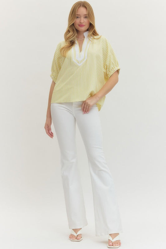 Striped woven top with short dolman sleeves, contrast V-neck panel, and relaxed fit