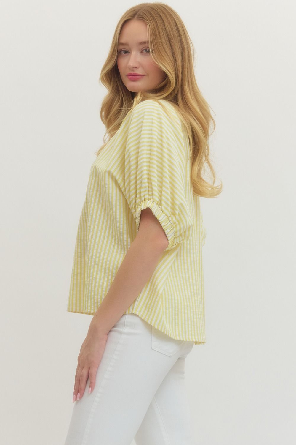 Striped woven top with short dolman sleeves, contrast V-neck panel, and relaxed fit