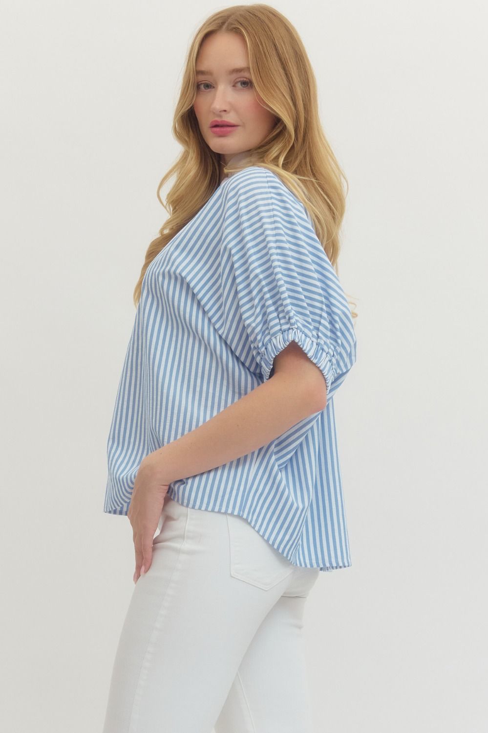 Striped woven top with short dolman sleeves, contrast V-neck panel, and relaxed fit