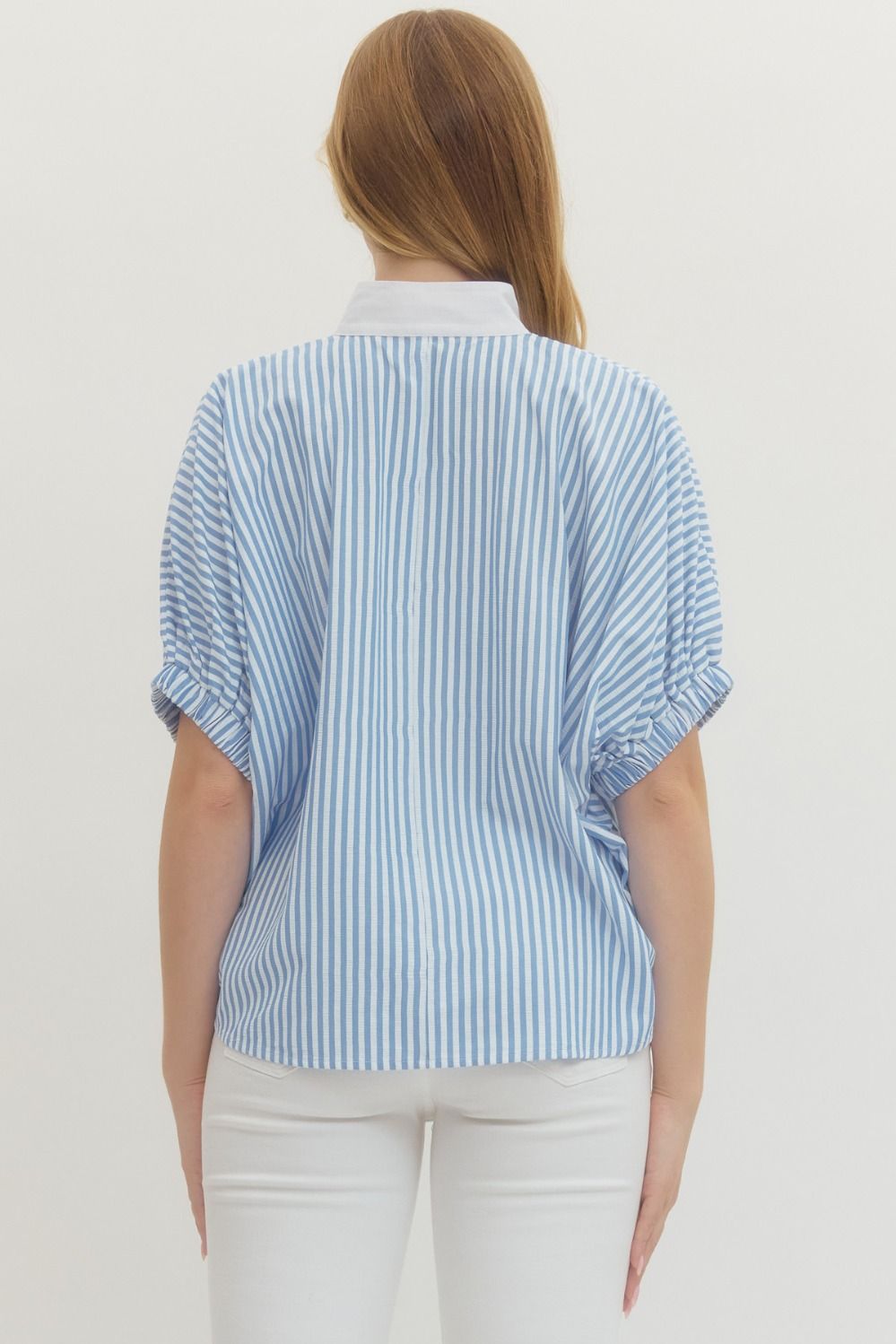 Striped woven top with short dolman sleeves, contrast V-neck panel, and relaxed fit