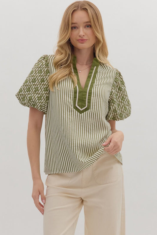 Playful yet refined, the Sylvie top pairs bold stripes with embroidered puff sleeves and contrast trim.