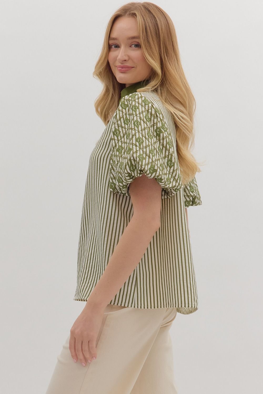 Playful yet refined, the Sylvie top pairs bold stripes with embroidered puff sleeves and contrast trim.