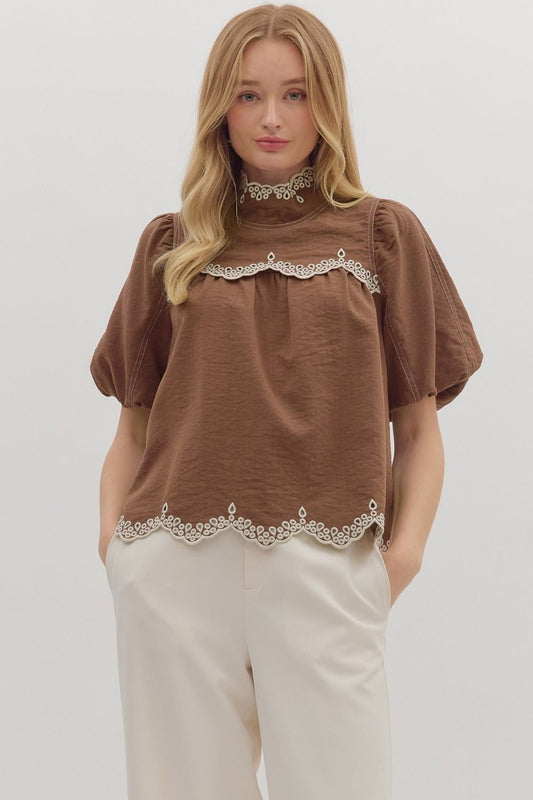 The Isolde top features romantic puff sleeves and scallop embroidered trim for a timeless, feminine finish.