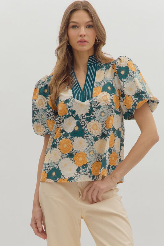 Chic and airy, the Seraphine top features bubble sleeves and a caftan-inspired neckline with contrast stitching.