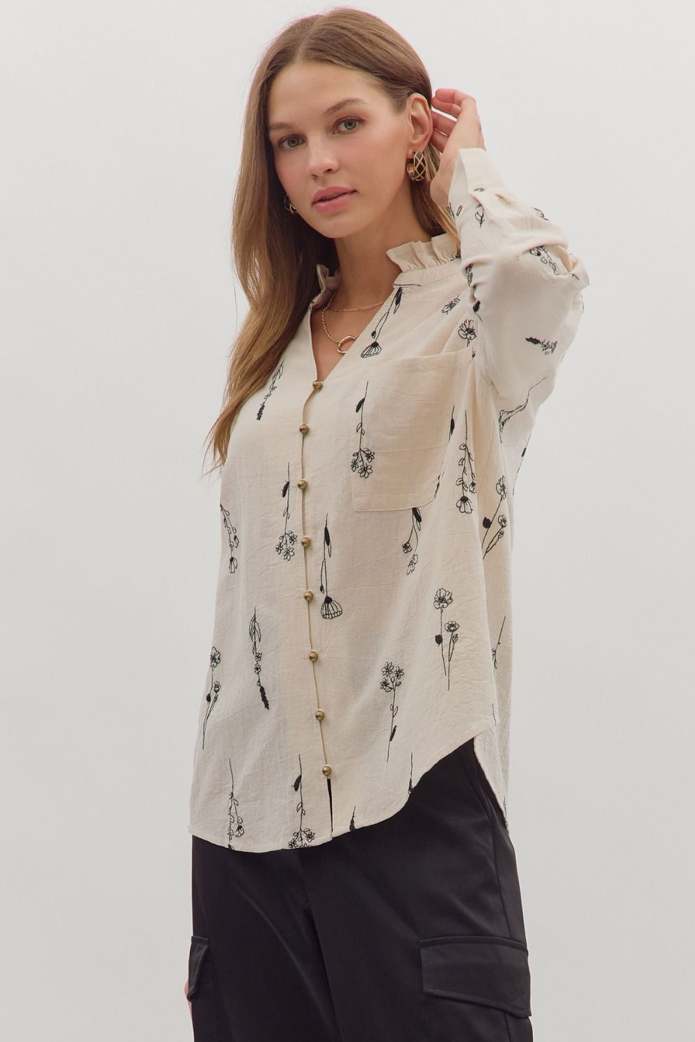 Delicate botanical embroidery meets classic tailoring in the Fiona long sleeve top with ruffled band collar.