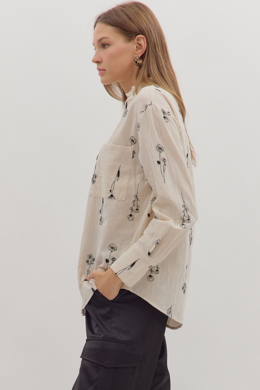 Delicate botanical embroidery meets classic tailoring in the Fiona long sleeve top with ruffled band collar.