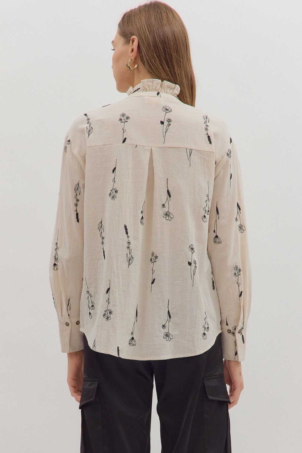 Delicate botanical embroidery meets classic tailoring in the Fiona long sleeve top with ruffled band collar.