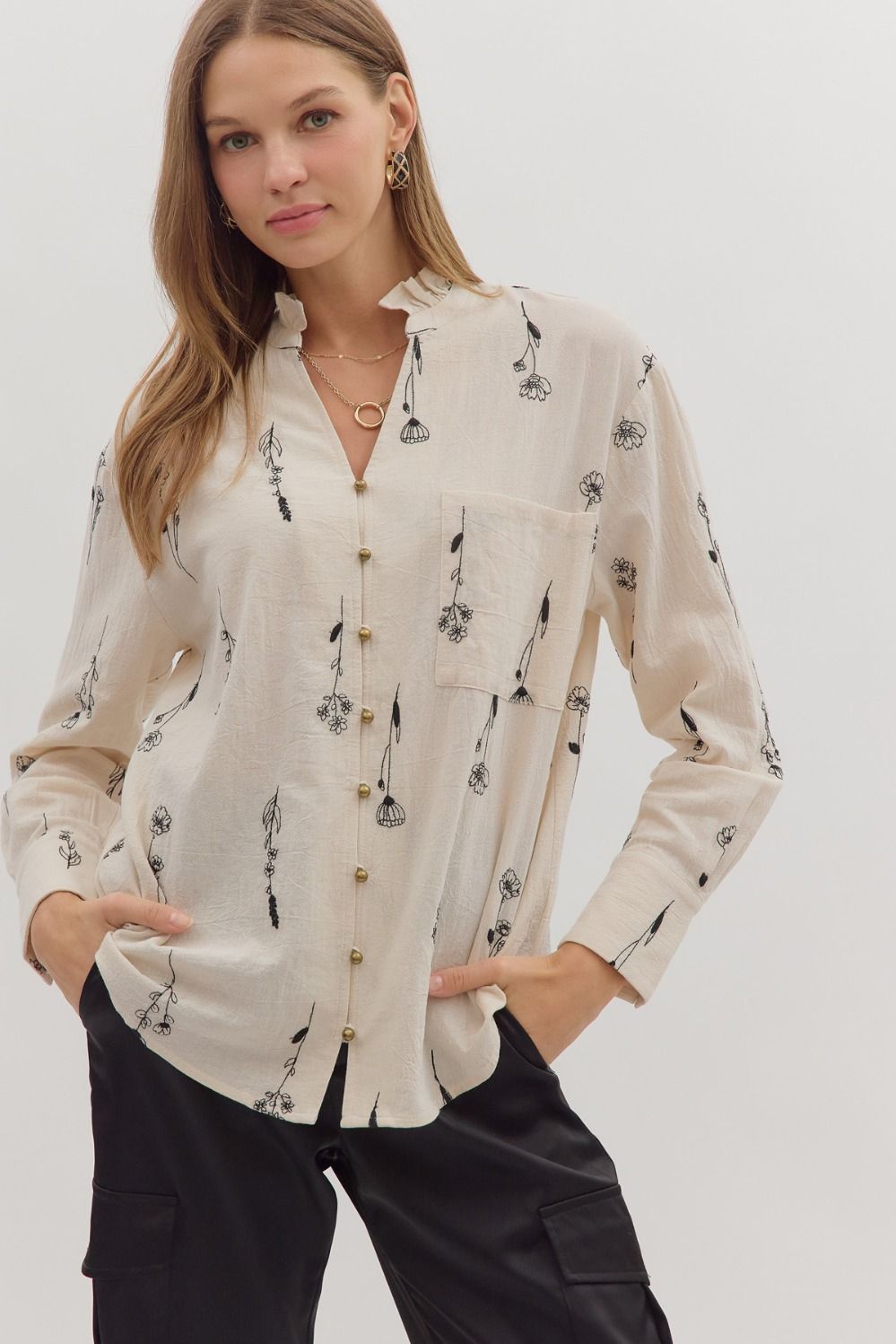 Delicate botanical embroidery meets classic tailoring in the Fiona long sleeve top with ruffled band collar.