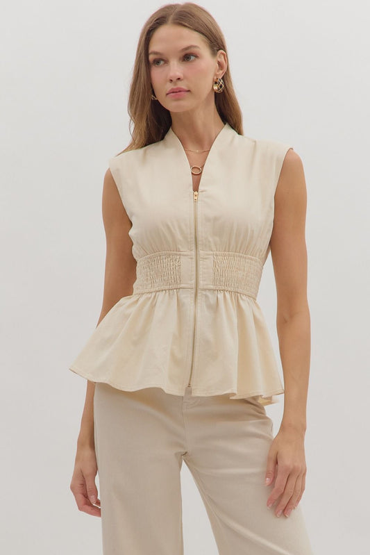 Chic and flattering, the Marceline top features a peplum silhouette with a wide smocked waist for a tailored finish.