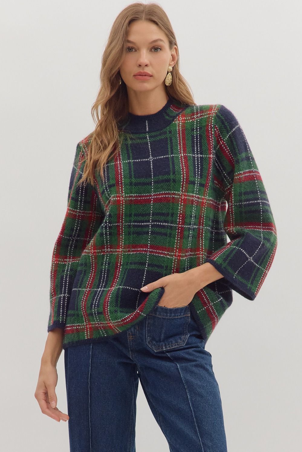 Cozy and classic, the Imogen sweater blends plaid patterning with a relaxed mock neck silhouette.
