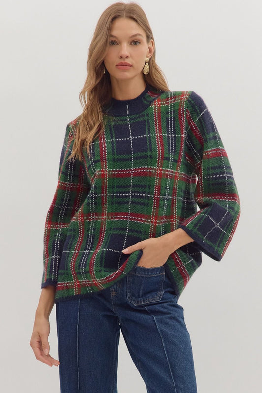 Cozy and classic, the Imogen sweater blends plaid patterning with a relaxed mock neck silhouette.
