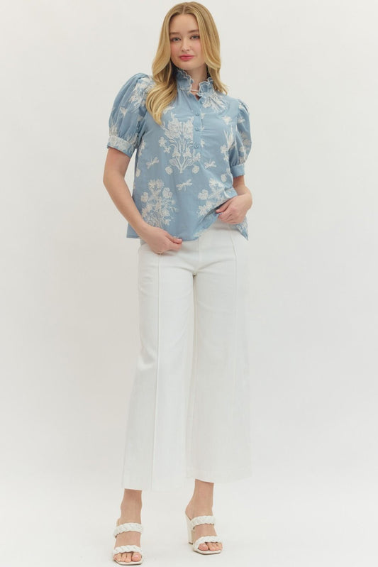 cotton top with embroidered detailing, scalloped mock neck, and short puff sleeves
