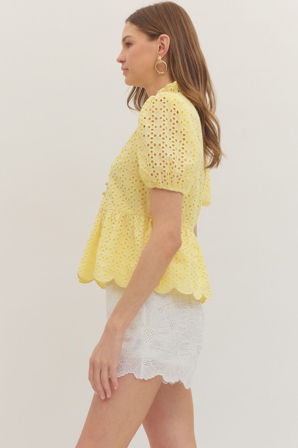 cotton top with puff sleeves, eyelet embroidery, ruffled V-neck, and scallop-trimmed hem