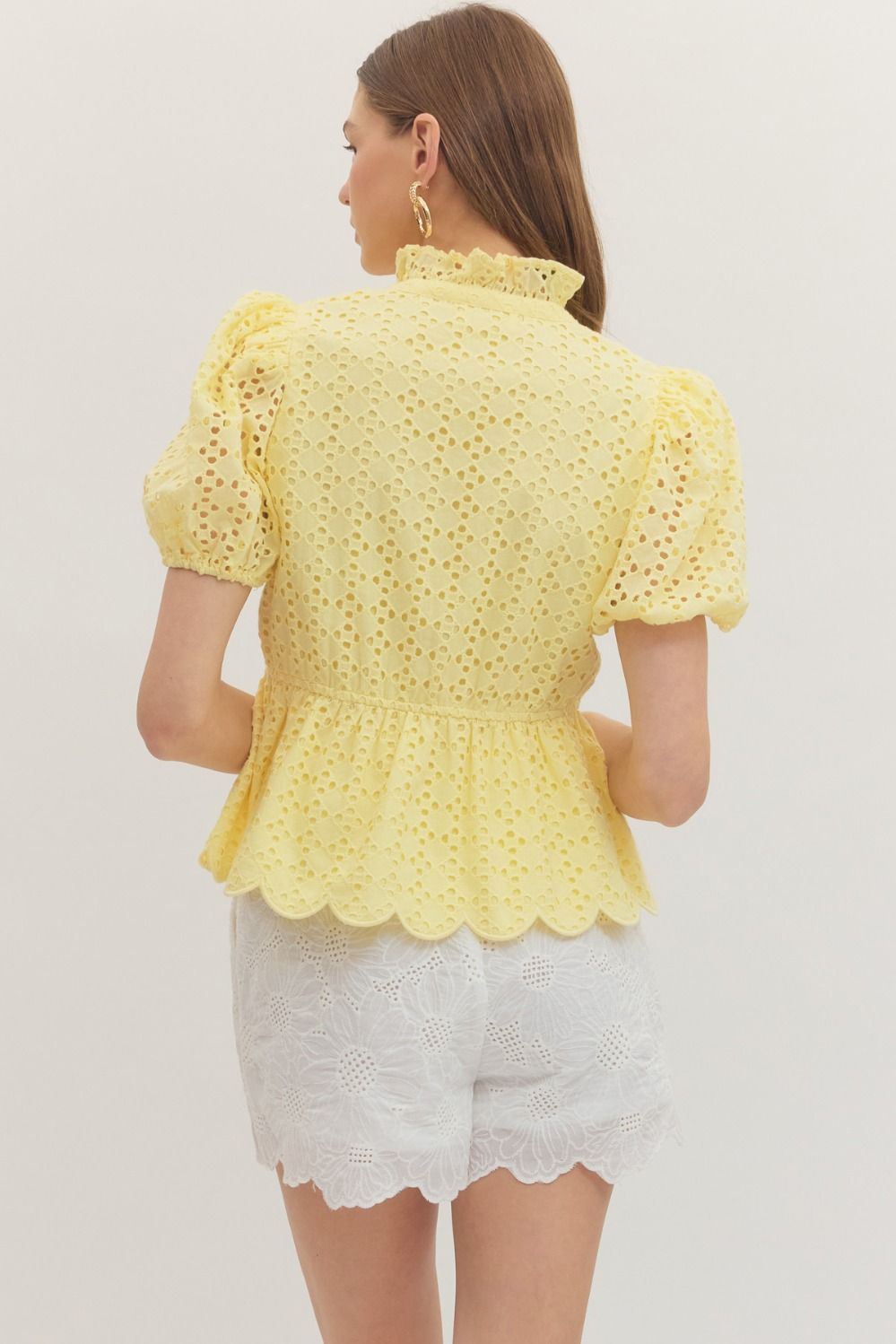 cotton top with puff sleeves, eyelet embroidery, ruffled V-neck, and scallop-trimmed hem