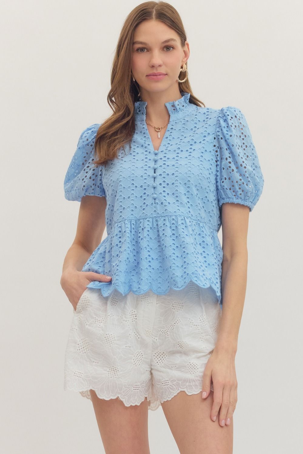 cotton top with puff sleeves, eyelet embroidery, ruffled V-neck, and scallop-trimmed hem