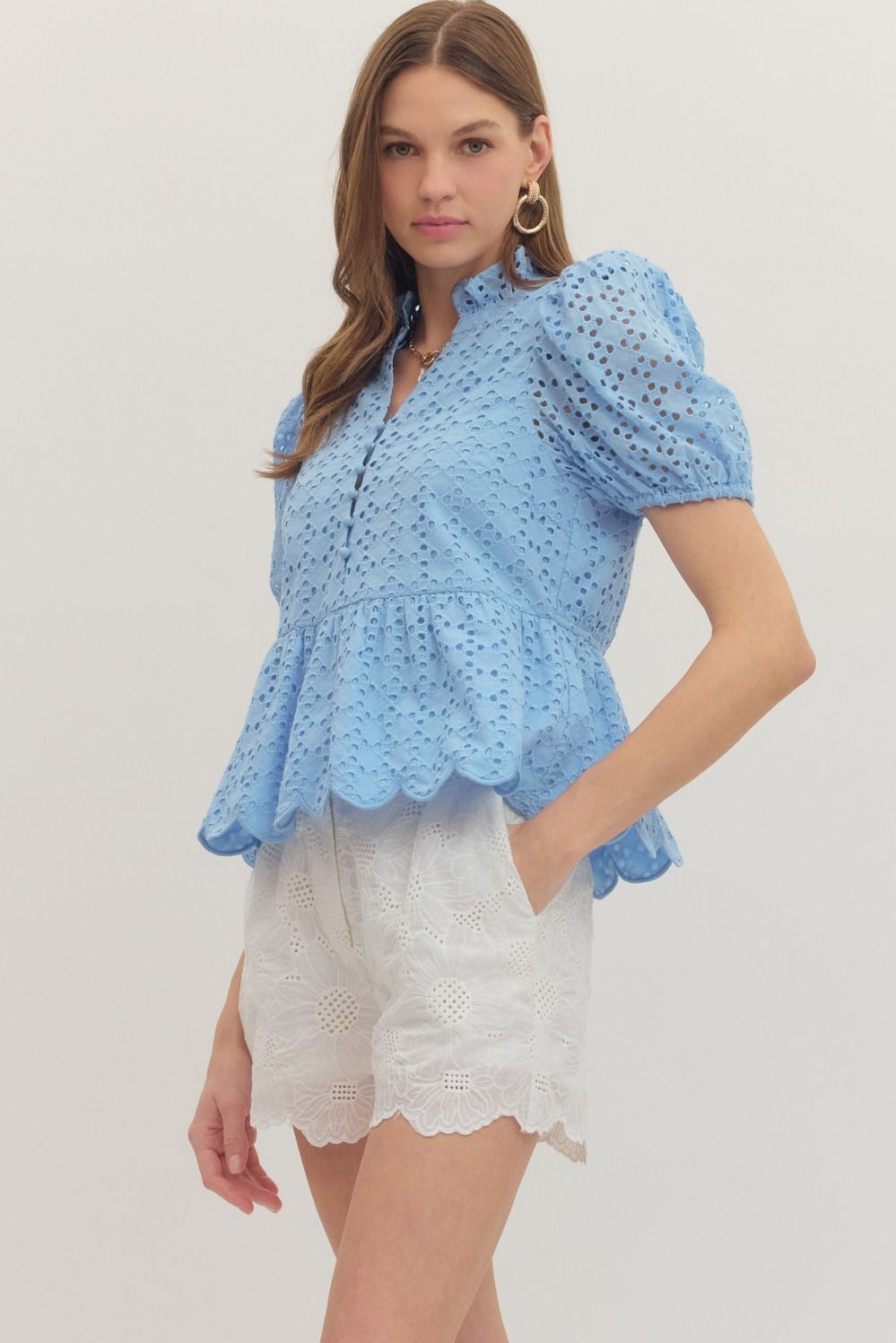 cotton top with puff sleeves, eyelet embroidery, ruffled V-neck, and scallop-trimmed hem